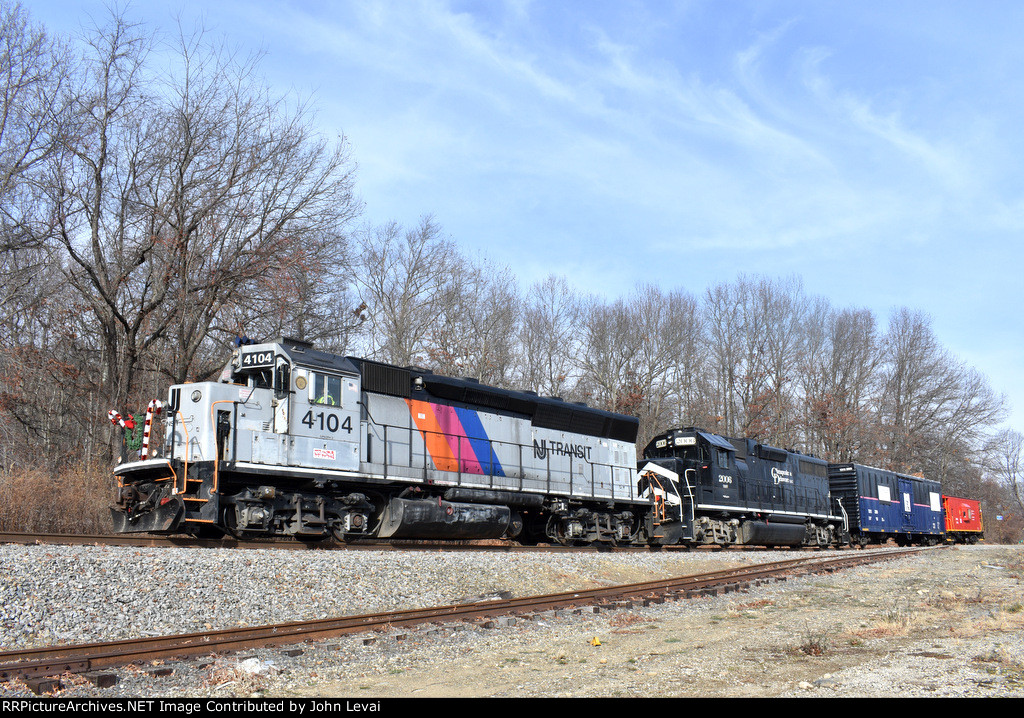 NJT GP40PH-2 # 4104 and C&D GP38-2 # 2006 lead the train through Wharton-I took this picture behind Juntila Bumpers 